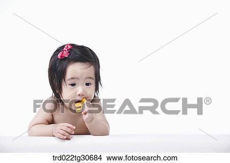 Baby girl with red ribbon View Large Photo Image Picture - Baby girl with red ribbon. Fotosearch
