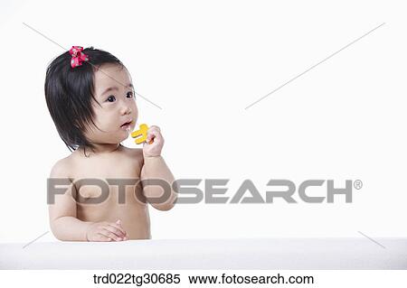 Baby girl with red ribbon View Large Photo Image Stock Photography - Baby girl with red ribbon. Fotosearch
