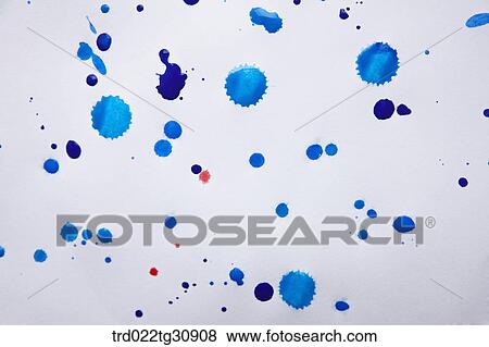 Stock Photo - Blue paints splattered on a paper . Fotosearch