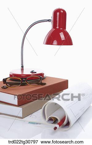 Books and red lamp and a glasses View Large Photo Image Stock Photo - Books and red lamp and a glasses. Fotosearch