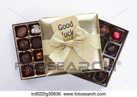 Stock Photograph - Box of chocolate and a good luck message. Fotosearch