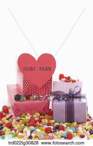 Stock Photo - Boxes and sweets with a MUST PASS message. Fotosearch