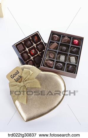 Stock Photo - Boxes of chocolates and a good luck message. Fotosearch