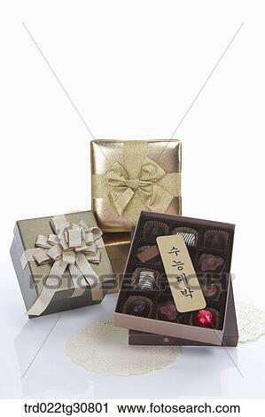 Stock Image - Boxes of chocolates wishing good luck. Fotosearch
