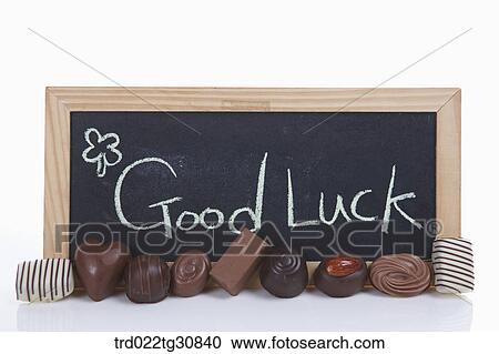 Chocolates with a good luck message board View Large Photo Image Stock Image - Chocolates with a good luck message board. Fotosearch