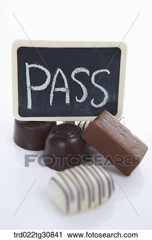 Chocolates with a PASS message board View Large Photo Image Stock Image - Chocolates with a PASS message board. Fotosearch