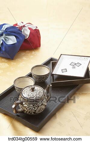 Stock Photo - Classical tea set and gifts. Fotosearch