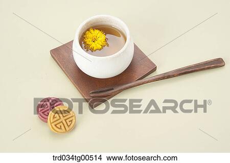 Picture - Cup of dandelion tea and korean traditional sweets. Fotosearch