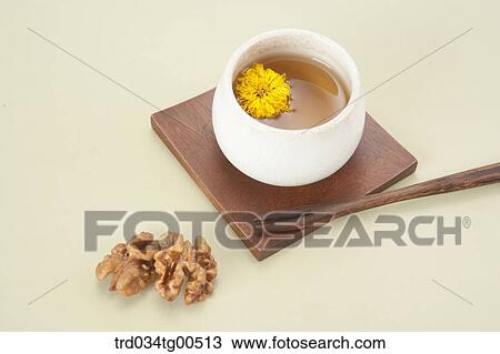 Cup of dandelion tea and walnuts View Large Photo Image Stock Image - Cup of dandelion tea and walnuts. Fotosearch