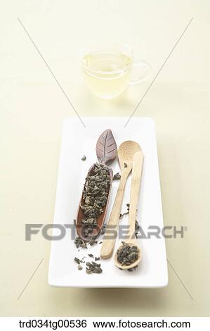 Cups of green tea and a cup of tea leaves View Large Photo Image Stock Photograph - Cups of green tea and a cup of tea leaves. Fotosearch