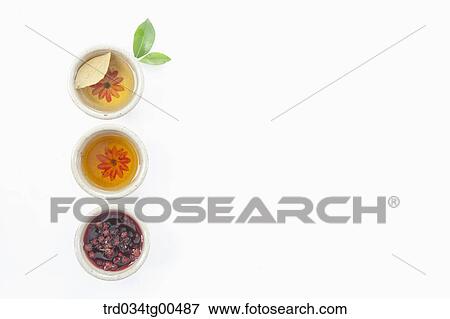 Stock Photo - Cups of various tea with fruits and leaves. Fotosearch