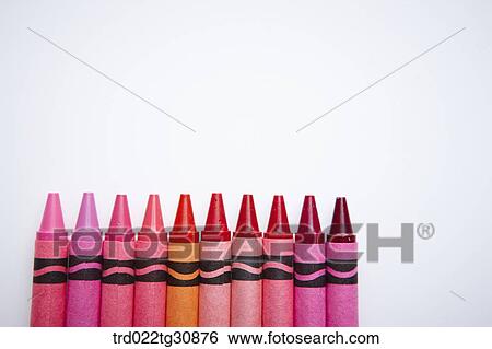 Stock Photograph - Many crayons in red and pink tone arrayed. Fotosearch