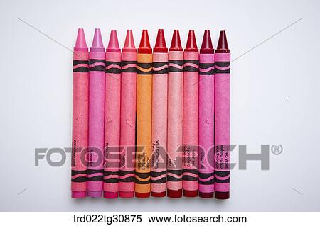 Stock Photography - Many crayons in red and pink tone arrayed. Fotosearch