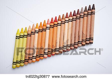 Stock Photo - Many crayons in yellow to brown tones arrayed. Fotosearch