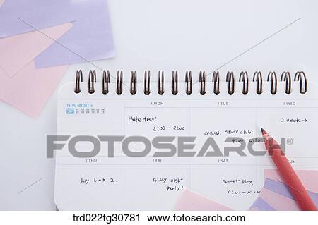 Stock Image - Post its and a diary with notes. Fotosearch
