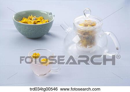 Tea pot and a cup of dandelion tea and its dried flowers View Large Photo Image Stock Photograph - Tea pot and a cup of dandelion tea and its dried flowers. Fotosearch