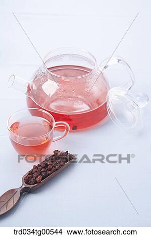 Tea pot and a cup of Omija tea and its dried fruits View Large Photo Image Picture - Tea pot and a cup of Omija tea and its dried fruits. Fotosearch