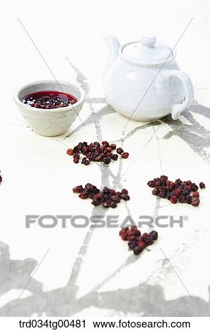 Tea pot and a cup of Omija tea View Large Photo Image Stock Image - Tea pot and a cup of Omija tea. Fotosearch