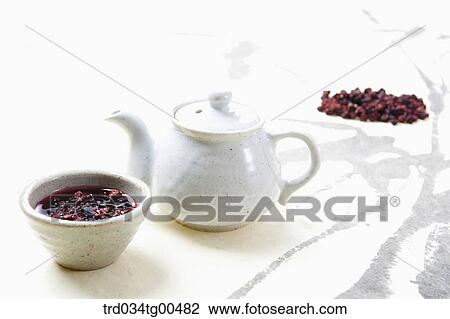 Tea pot and a cup of Omija tea View Large Photo Image Stock Image - Tea pot and a cup of Omija tea. Fotosearch