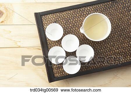 Stock Photo - White cups of green tea. Fotosearch