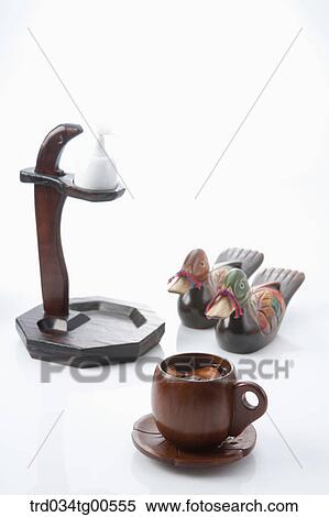 Stock Photography - Wooden cup of tea and korean traditional ornaments. Fotosearch