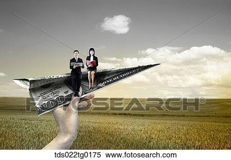 someone's hand holding paper airplane which has business people View Large Illustration Stock Illustration - someone's hand holding paper airplane which has business people. Fotosearch