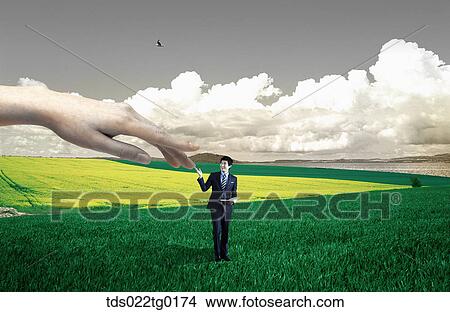 Stock Illustration - someone's hand touches businessman who is standing on the field. Fotosearch