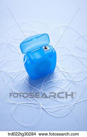 A blue dental floss View Large Photo Image Picture - A blue dental floss. Fotosearch