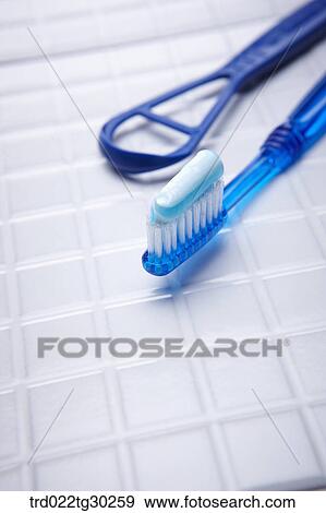 A blue tooth brush with tooth paste on View Large Photo Image Stock Photo - A blue tooth brush with tooth paste on . Fotosearch