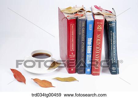 Stock Photo - A Cup Of Coffee And Books With Fallen Leaves. Fotosearch