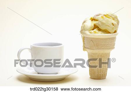 A cup of coffee next to vanila ice cream cone View Large Photo Image Stock Photo - A cup of coffee next to vanila ice cream cone. Fotosearch