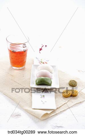 Stock Photo - A cup of drink and Korean rice cake . Fotosearch