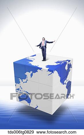 A man standing on the earch block with his arms open View Large Photo Image Stock Photo - A man standing on the earch block with his arms open. Fotosearch