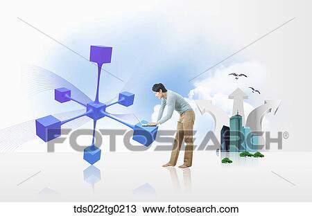 Stock Image - A man typing laptop on the blue block. Fotosearch