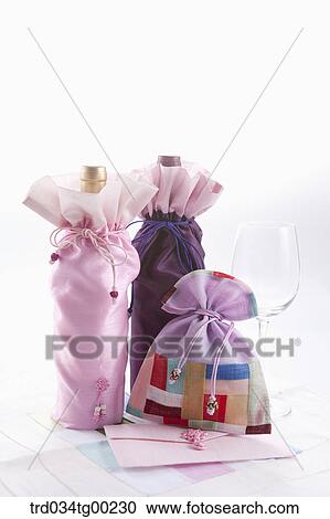 A patched lucky bags and wrapped bottes with glass View Large Photo Image Stock Image - A patched lucky bags and wrapped bottes with glass. Fotosearch