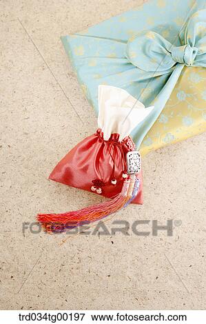 A red lucky bag with blue wrapped package in cloth View Large Photo Image Stock Photo - A red lucky bag with blue wrapped package in cloth . Fotosearch