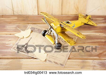 Stock Image - Autumn With Fallen Leaves And Model Airplane. Fotosearch