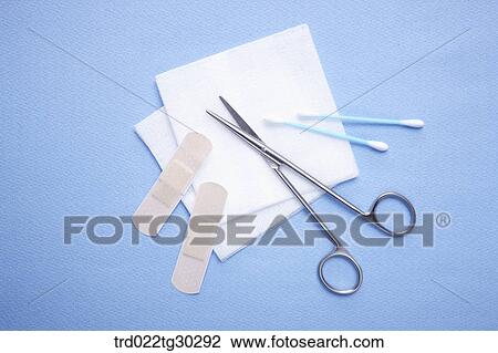 Blue cotton swaps, bandages, pieces of cotton, and scissors View Large Photo Image Stock Image - Blue cotton swaps, bandages, pieces of cotton, and scissors. Fotosearch