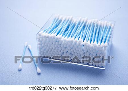 Stock Photo - Blue cotton swaps in plastic container. Fotosearch