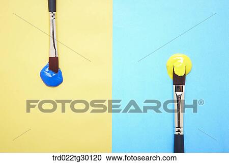Blue paint on yellow background and yellow paint on blue background with paintbrushes View Large Photo Image Stock Image - Blue paint on yellow background and yellow paint on blue background with paintbrushes. Fotosearch