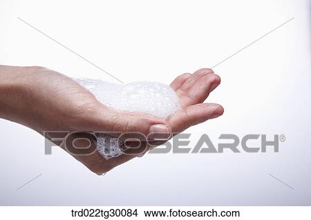 Picture - bubbles in the hands. Fotosearch