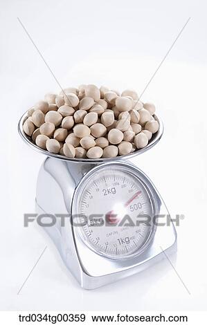 Stock Photo - Bunch Of Ginkos On A Scale. Fotosearch