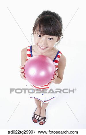 close up of girl is holding beach ball View Large Photo Image Stock Photo - close up of girl is holding beach ball. Fotosearch