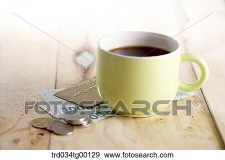 coffee on the money bills with credit card and coins View Large Photo Image Stock Photo - coffee on the money bills with credit card and coins. Fotosearch