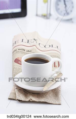 coffee on the newspaper View Large Photo Image Picture - coffee on the newspaper. Fotosearch
