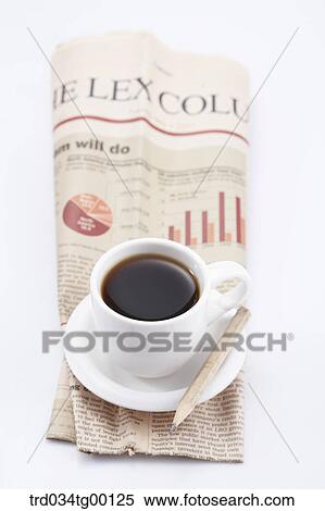 Stock Photography - coffee on the newspaper. Fotosearch