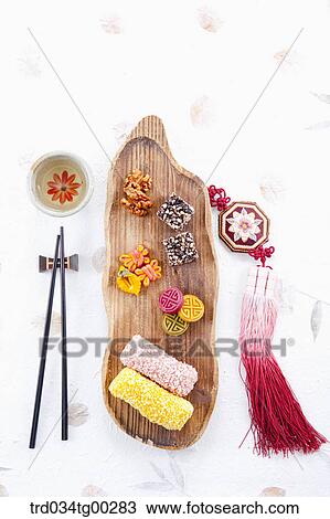 Colorful Korean dessert, a cup of tea, chopsticks, and clothes accessory View Large Photo Image Stock Image - Colorful Korean dessert, a cup of tea, chopsticks, and clothes accessory . Fotosearch