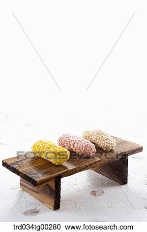 Stock Image - Colorful Korean dessert on the wooden dish . Fotosearch