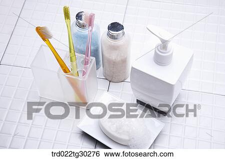 Colorful tooth brushes in cup, Bottles of bath salt, shampoo and soap View Large Photo Image Stock Photograph - Colorful tooth brushes in cup, Bottles of bath salt, shampoo and soap . Fotosearch