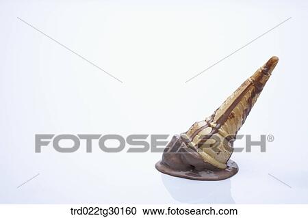 Stock Image - Crushed chocolate ice cream cone. Fotosearch